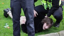 A member of the public is arrested by Police after throwing eggs at King Charles III and Camilla, Queen Consort as they arrive for the Welcoming Ceremony to the City of York at Micklegate Bar during an official visit to Yorkshire on Nov. 09, 2022 in York, England.