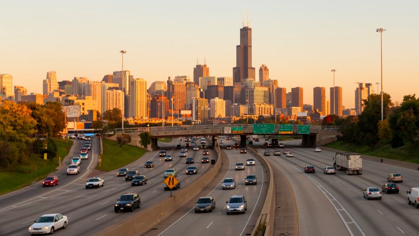 Traffic on the Kennedy Expressway in Chicago at sunset, looking toward the skyline.