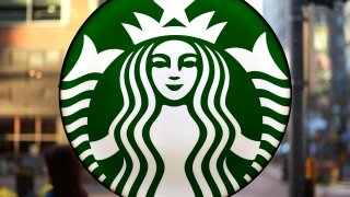 FILE - The Starbucks logo is displayed in the window of a downtown Pittsburgh Starbucks on Nov. 7, 2022.