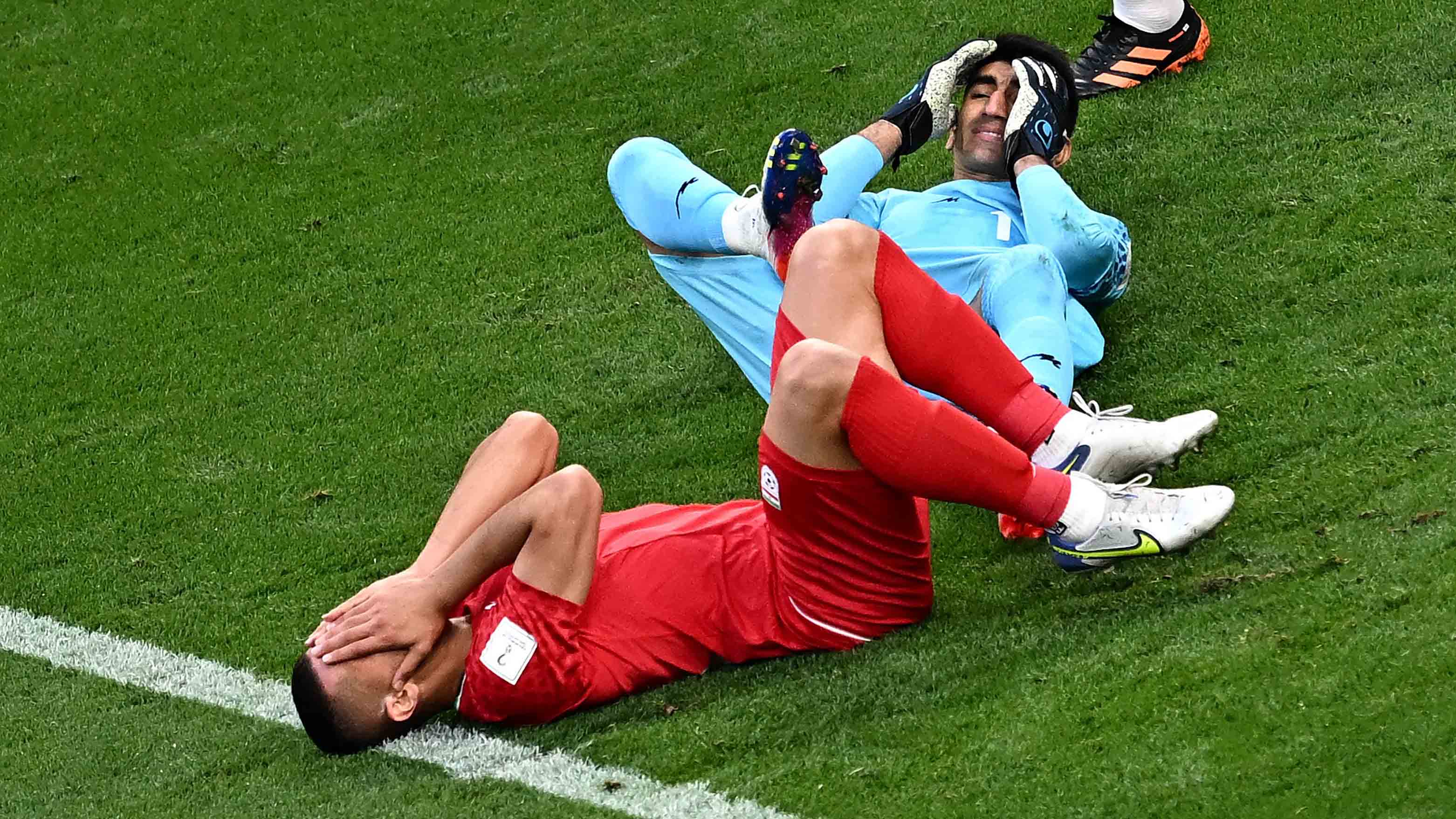 Iran’s goalkeeper #01 Alireza Beiranvand and Iran’s defender #19 Majid Hosseini collide during the Qatar 2022 World Cup Group B football match between England and Iran at the Khalifa International Stadium in Doha, Nov. 21, 2022.