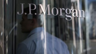 A person enters the JPMorgan Chase headquarters in New York, June 30, 2022.