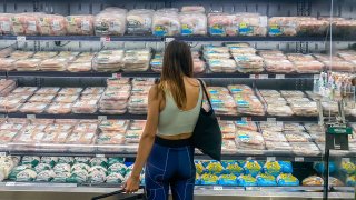 A woman shops for chicken at a supermarket in Santa Monica, California, on Sept. 13, 2022.