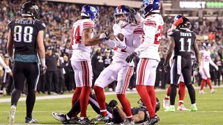 Dane Belton #24 of the New York Giants celebrates with teammates after an interception during the third quarter against the Philadelphia Eagles at Lincoln Financial Field on January 08, 2023 in Philadelphia, Pennsylvania. (Photo by Mitchell Leff/Getty Images)