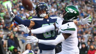 Noah Fant #87 of the Seattle Seahawks attempts to catch a pass while defended by Sauce Gardner #1 of the New York Jets during the fourth quarter at Lumen Field on January 01, 2023 in Seattle, Washington. (Photo by Lindsey Wasson/Getty Images)