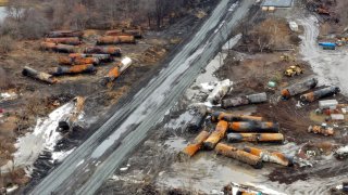 This photo taken with a drone shows the continuing cleanup of portions of a Norfolk Southern freight train that derailed Friday night in East Palestine, Ohio, Thursday, Feb. 9, 2023.