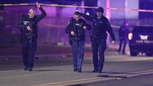 East Lancing, Michigan - February 14: Police are seen at the scene on Lake Lansing Road where a body is seen on the side of the road hours after at least 5 people were injured on the MIchigan State University Campus. (Photo by Rey Del Rio for The Washington Post via Getty Images)