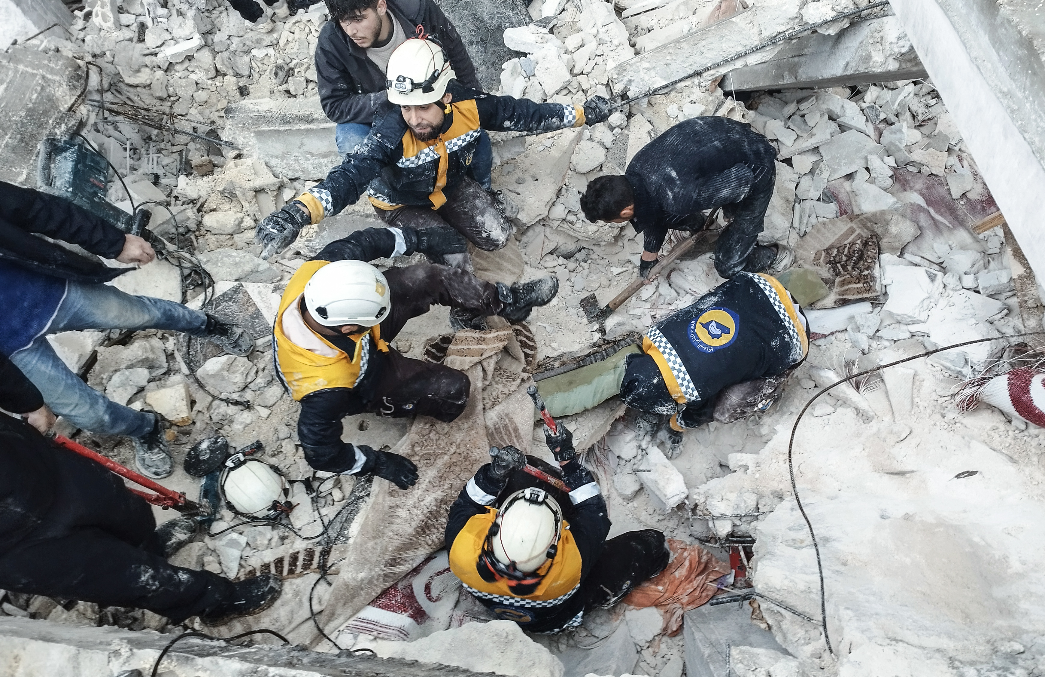 People search for victims and survivors from the rubble of a building in Afrin, Syria, Feb. 6, 2023.  Two massive earthquakes – at 7.8 magnitude and 7.5 magnitude respectively – struck in the border region of Turkey and Syria early Monday morning, killing thousands as they slept.