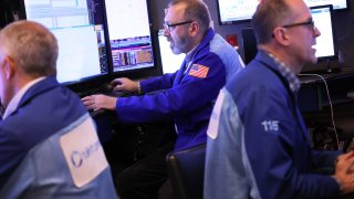 Traders work on the floor of the New York Stock Exchange during morning trading on February 22, 2023 in New York City.