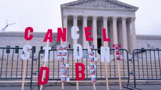 A protest sign outside the Supreme Court in Washington, D.C., on Feb. 28, 2023.