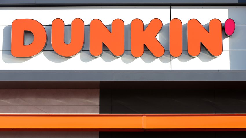 FILE - A sign outside a Dunkin' store in Quincy, Mass., is pictured on Jan. 16, 2018.