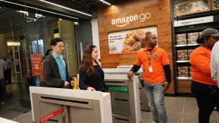 People shop at the newly opened Amazon Go Store on May 07, 2019 in New York City. The cashier-less store, the first of this type of store, called Amazon Go, accepts cash and is the 12th such store in the United States located at Brookfield Place in downtown New York. The roughly 1,300-square-foot store sells a variety of food items, prepared meals and Amazon's own meal kits. It is believed that by 2021 Amazon is considering opening up as many as 3,000 of its cashier-free stores across the United States. (Photo by Spencer Platt/Getty Images)
