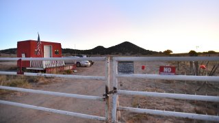 File photo – A general view shows a locked gate at the entrance to the Bonanza Creek Ranch on October 22, 2021, in Santa Fe, New Mexico.