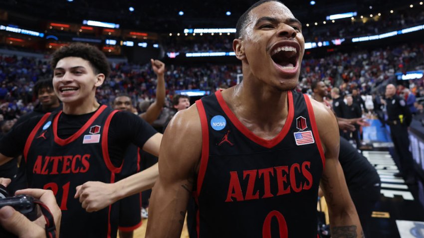 LOUISVILLE, KENTUCKY – MARCH 24: Keshad Johnson #0 of the San Diego State Aztecs and Miles Byrd #21 of the San Diego State Aztecs celebrate after defeating the Alabama Crimson Tide, 71-64, during the second half in the Sweet 16 round of the NCAA Men’s Basketball Tournament at KFC YUM! Center on March 24, 2023 in Louisville, Kentucky. (Photo by Rob Carr/Getty Images)