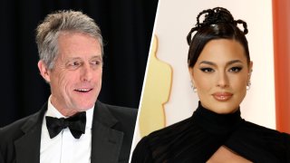 English actor Hugh Grant, left, and Ashley Graham at the 95th Academy Awards, March 12, 2023, in Hollywood, California.