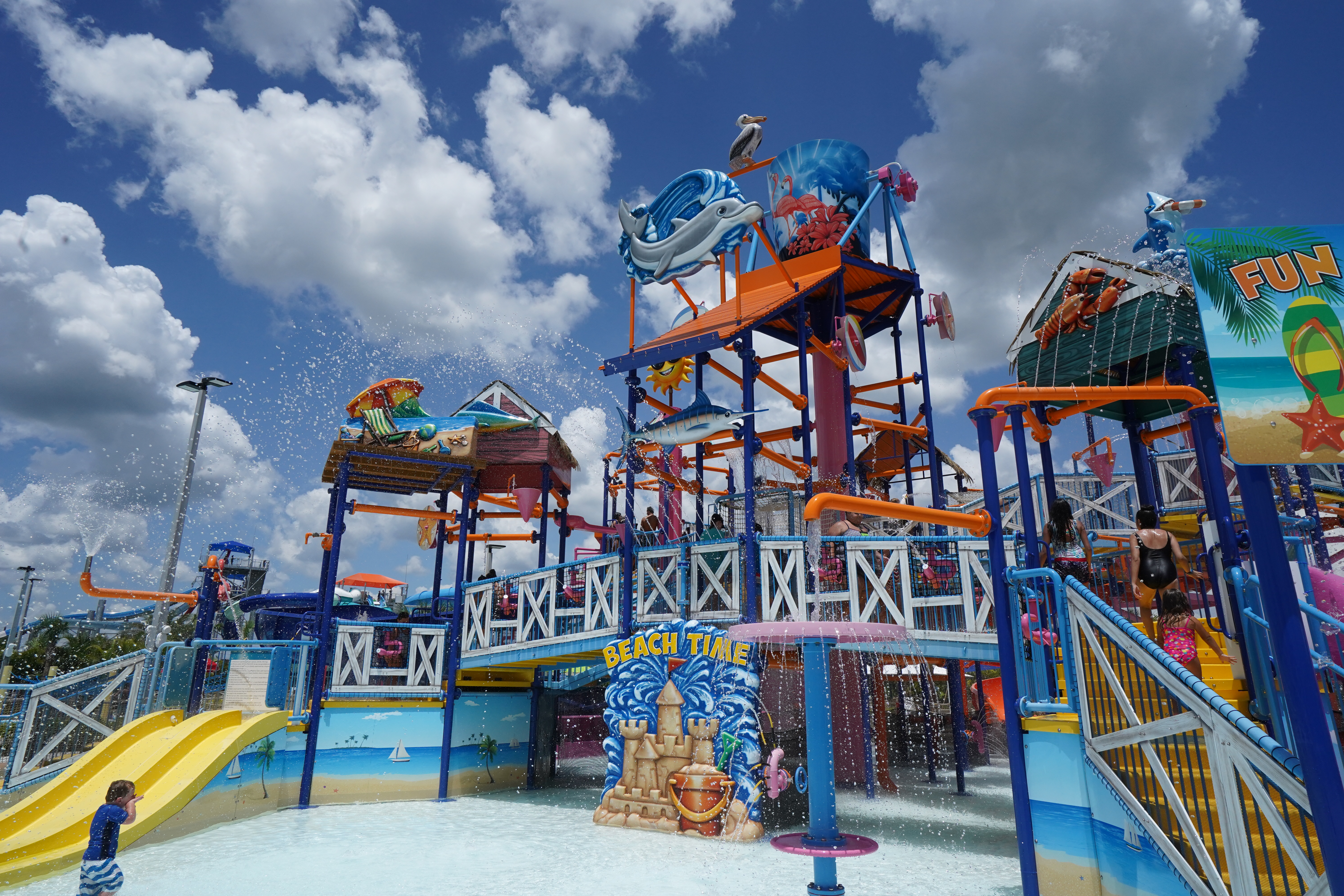 Splash Island water park feature on a partly cloudy day.