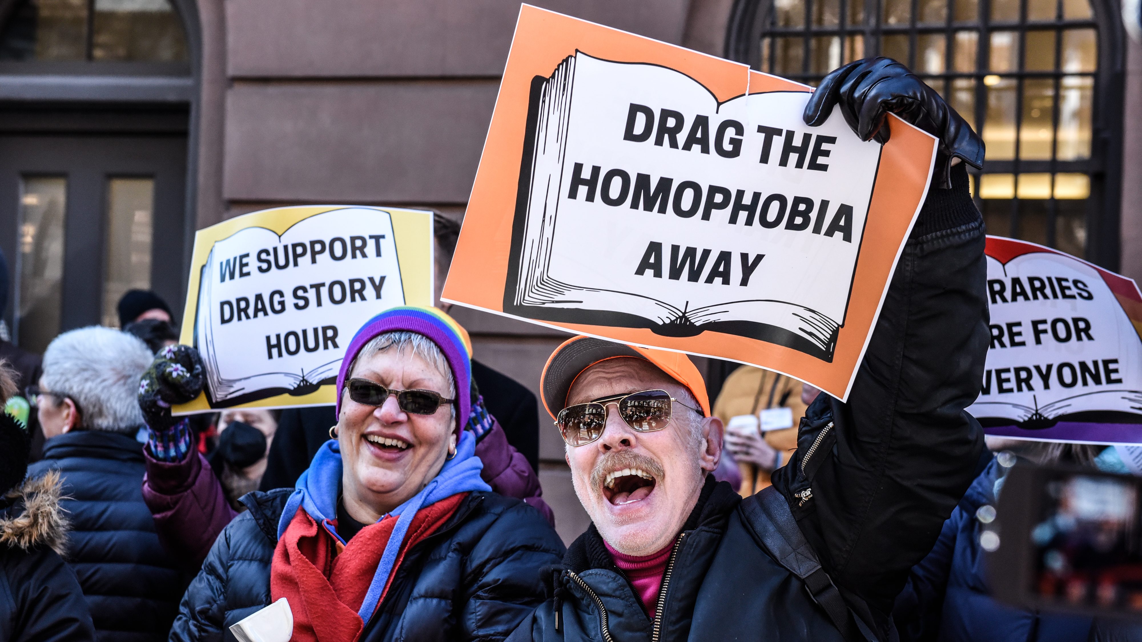 Protesters supporting Drag Queen story hour hold signs outside of The Center, a support space for LGBTQ+ people on March 19, 2023 in New York City.