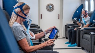 Two patients receiving hyperbaric oxygen therapy at Aviv Clinics in The Villages, Florida.