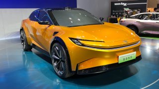 Toyota displays a new concept electric car — developed jointly with BYD and FAW — at the Shanghai auto show in April 2023.