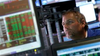 A trader works on the floor of the New York Stock Exchange.