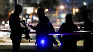 Israeli police stand at the scene of an attack in Tel Aviv, Israel, Friday, April 7, 2023.