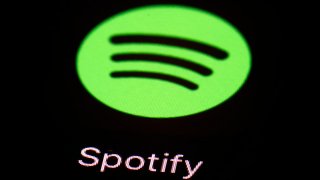 FILE – The Spotify app on an iPad is pictured, March 20, 2018, in Baltimore.