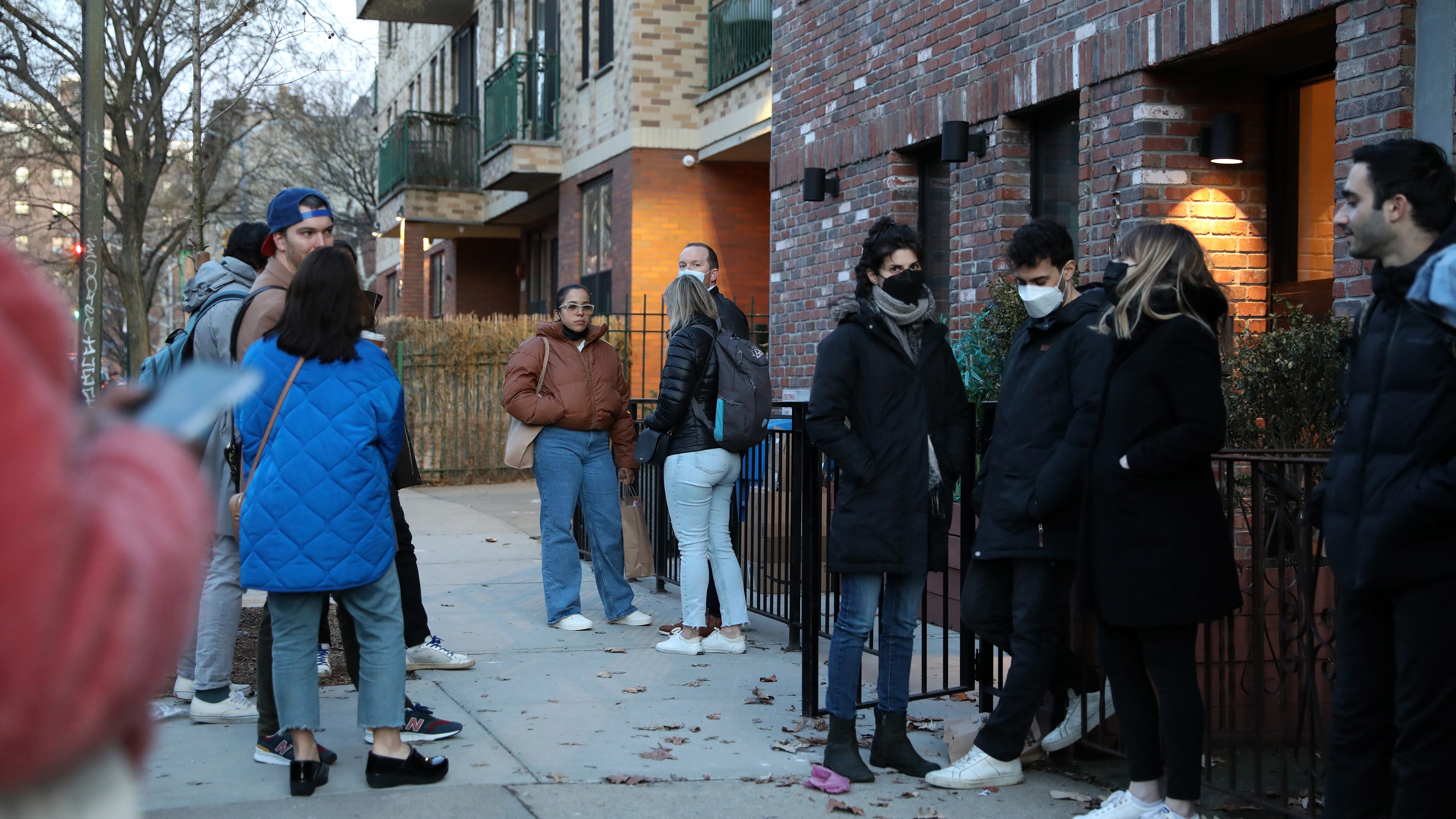 Prospective renters wait outside to enter an apartment unit during an open house in the Williamsburg neighborhood in Brooklyn. Photographer: Bess Adler/Bloomberg via Getty Images