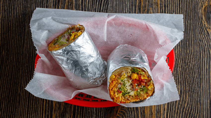 This image shows a stock photo of a burrito on a table in Massachusetts.