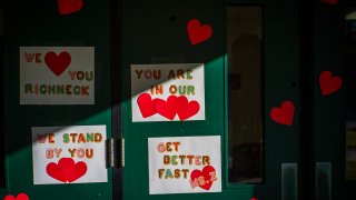 FILE - Messages of support for teacher Abby Zwerner, who was shot by a 6-year-old student, grace the front door of Richneck Elementary School Newport News, Va., on Jan. 9, 2023.