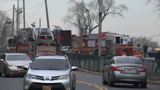 Fire trucks arrive at Rikers Island for fire allegedly started by inmate.