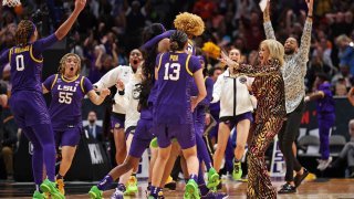 LSU women’s basketball team celebrates Jasmine Carson’s second-quarter buzzer beater.