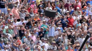 A wheel flies near a section of grandstand in the second turn after a collision between Andretti Autosport driver Kyle Kirkwood (27) Arrow McLaren SP driver Felix Rosenqvist (6) on Sunday, May 28, 2023, during the 107th running of the Indianapolis 500 at Indianapolis Motor Speedway.