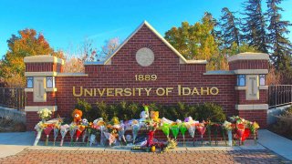 Flowers, notes and stuffed animals sit along the University of Idaho’s entrance sign on Pullman Road in Moscow to honor the four students stabbed to death in an off-campus home on Nov. 13.