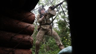 A Ukrainian soldier of the 28th Separate Mechanized Brigade fires at Russian positions at the front line near the town of Bakhmut in the Donetsk region, on June 17, 2023.