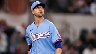 Jacob deGrom of the Texas Rangers returns to the dugout after his eleventh strikeout to end the inning during a game against the Oakland Athletics at Globe Life Field on April 23, 2023 in Arlington, Texas.