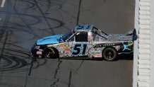 Denny Hamlin, driver of the No. 51 Jordan Brand Toyota, spins out on the frontstretch during the NASCAR Camping World Truck Series Kroger 200 at Martinsville Speedway on Oct. 26, 2013 in Martinsville, Va.