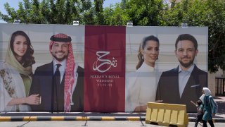 A poster with pictures of Crown Prince Hussein and his fiancee, Saudi architect Rajwa Alseif is posted at a road in Amman, Jordan, Wednesday, May 31, 2023. Crown Prince  Hussein and Saudi architect Rajwa Alseif are to be married on Thursday at a palace wedding in Jordan, a Western-allied monarchy that has been a bastion of stability for decades as Middle East turmoil has lapped at its borders.(AP Photo/Nasser Nasser)