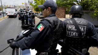 Members of the Mexican Federal Police arrive to patrol the city of Culiacan to reinforce the surveillance operation against drug trafficking in Sinaloa state, north of Mexico on May 28, 2008.