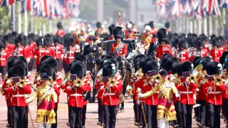 The Trooping of Color continues toward Buckingham Palace.