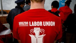 Amazon workers arrive with paperwork to unionize at the National Labor Relations Board office in Brooklyn, New York, Oct. 25, 2021.