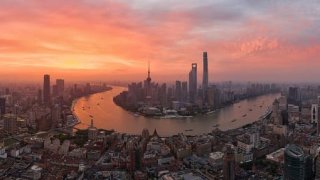 Aerial view of skyscrapers standing at the Lujiazui Financial District at sunrise on June 8, 2022 in Shanghai, China.