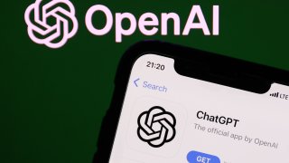 OpenAI logo on the website displayed on a phone screen and ChatGPT on AppStore displayed on a phone screen