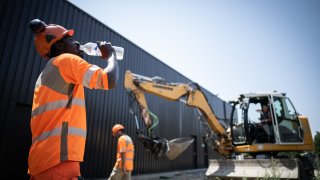 This image, from July 2022, shows construction workers enduring high temperatures at a site in Savenay, near Nantes, France.