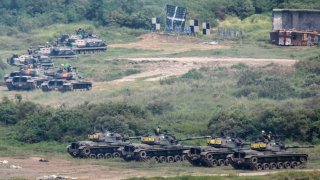 Taiwanese tanks and armored vehicles are deployed during a 2-day live-fire drill in September, amid intensifying threats from China. Taipei has been receiving more arms sales and weapons from the US, while fostering its ties with countries like Japan, the UK, Canada and India, as Beijing vows to unify Taiwan without excluding the possibility of using force. (Photo by Ceng Shou Yi/NurPhoto via Getty Images)