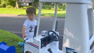 Colby and his mini mail truck (Jessica Bergman)