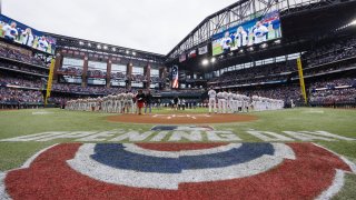 A general view of Globe Life Field as the Texas Rangers and the Philadelphia Phillies line the base paths for the national anthem prior to a game on Opening Day at Globe Life Field on March 30, 2023 in Arlington, Texas.