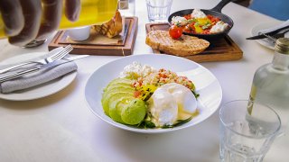 food on a table being dressed with olive oil