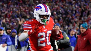 Nyheim Hines #20 of the Buffalo Bills runs the ball in for a touchdown against the Miami Dolphins at Highmark Stadium on December 17, 2022 in Orchard Park, New York.