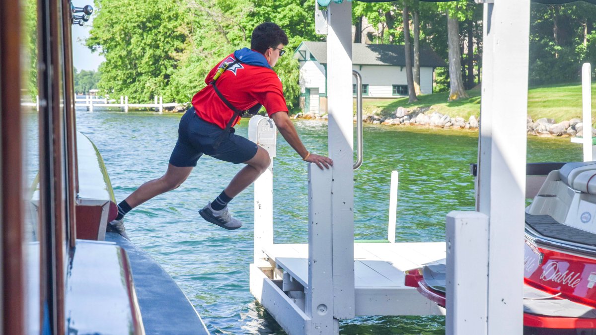 'The coolest summer job': These teens jump off a moving boat to deliver mail in Wisconsin – NBC New York - Vimarsana News