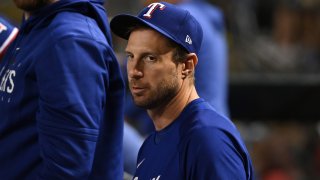 Max Scherzer #31 of the Texas Rangers looks on from the dugout against the Arizona Diamondbacks at Chase Field on August 22, 2023 in Phoenix, Arizona.