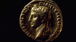 A Roman coin bearing the likeness of Augustus Caesar.